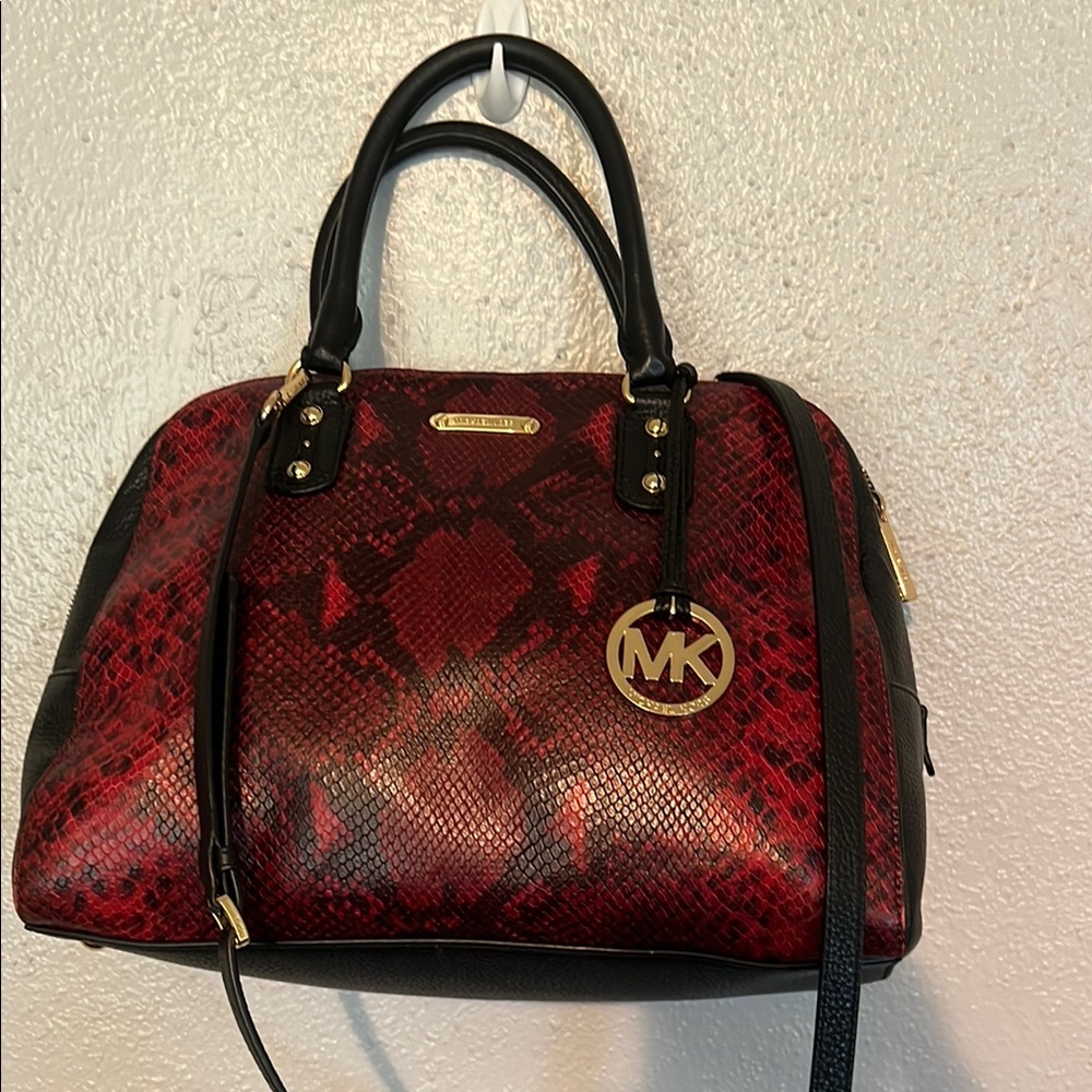 This Michael Michael Kors snake has never been carried